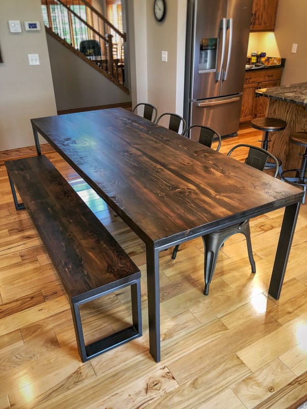 https://graindesigns.com/wp-content/uploads/2022/10/Custom-Built-Metal-Four-Legged-Dining-Table-and-Bench-Set-Dark-Walnut-Top.jpg