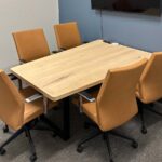 Light wood natural office meeting table - Butterscotch faux leather rolling meeting chair