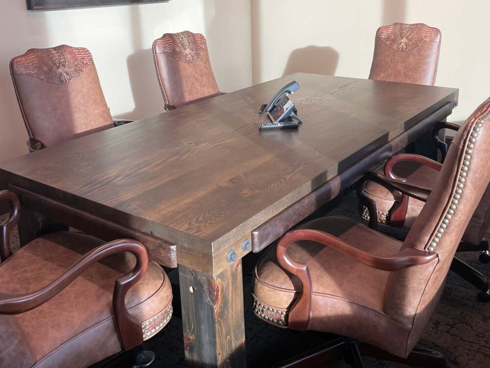 Dark wood office meeting table - ornate leather office chairs