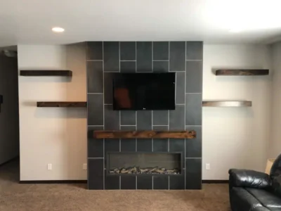 Dark Wood Fireplace Mantel and Floating Shelves