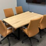 Light wood natural office meeting table - Butterscotch faux leather rolling meeting chair