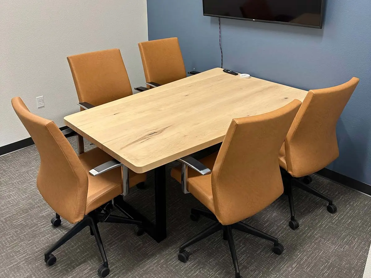 Light wood natural office meeting table - Butterscotch faux leather rolling meeting chair