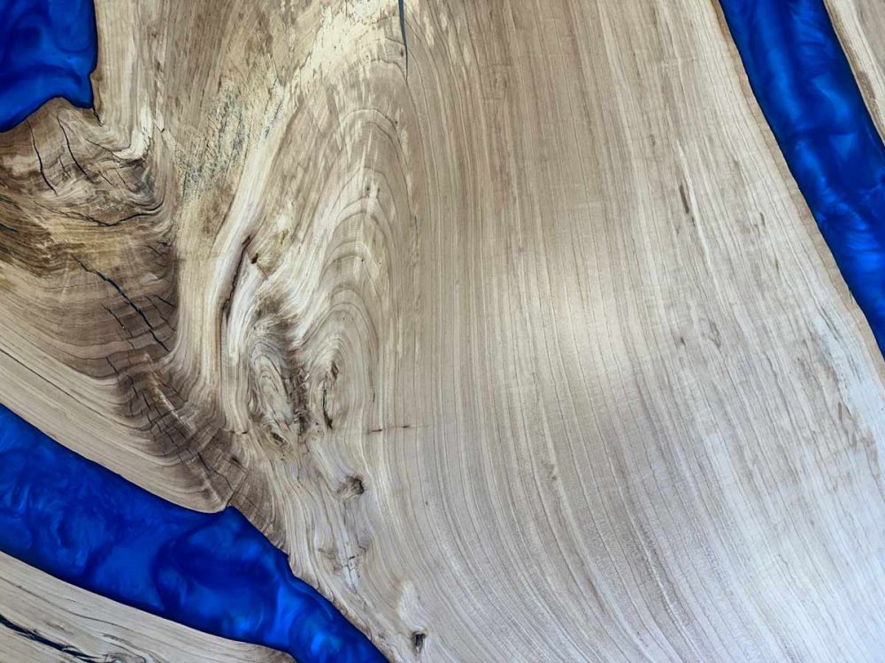 Wood and epoxy resin round bar table top - natural unstained elm wood with blue epoxy rivers